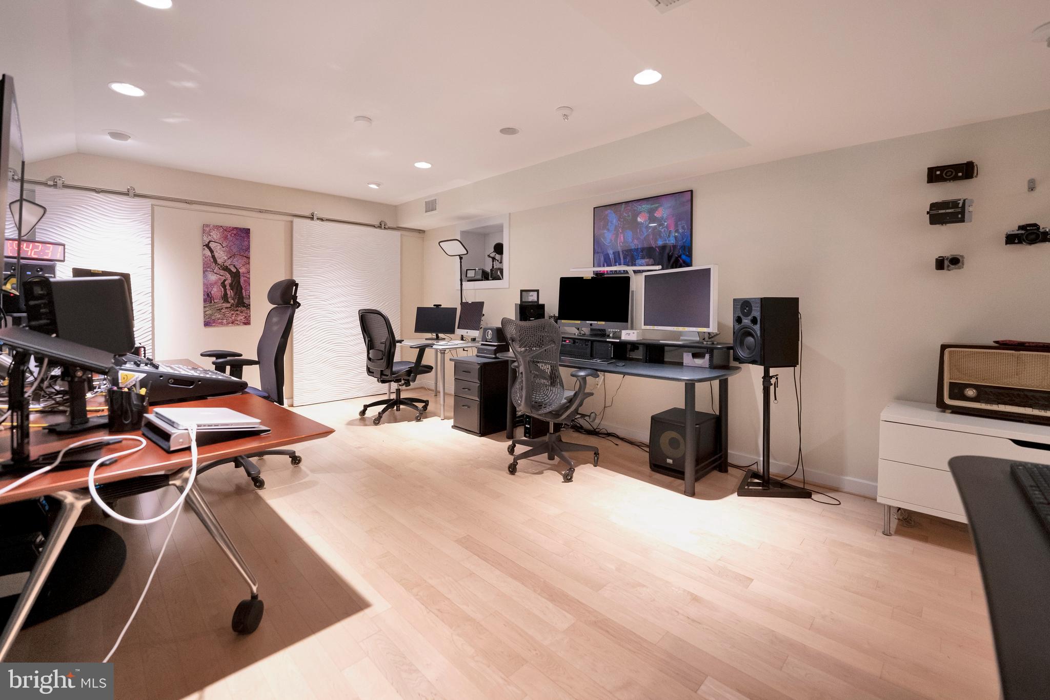 3214 Foxvale Drive Oakton, VA 22124 - Photo 39 of 56 a view of a workspace with furniture and a flat screen tv