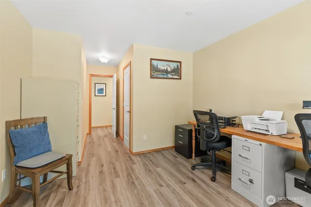 a bathroom with a granite countertop sink a toilet and a mirror