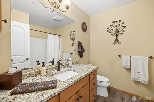 a bathroom with a shower and a bath tub