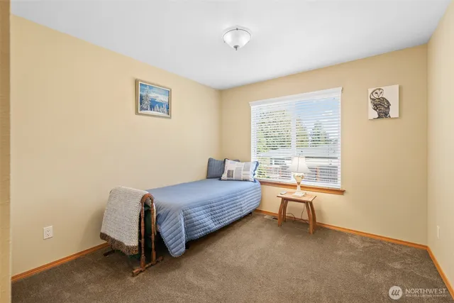 a bedroom with a bed and a cabinets