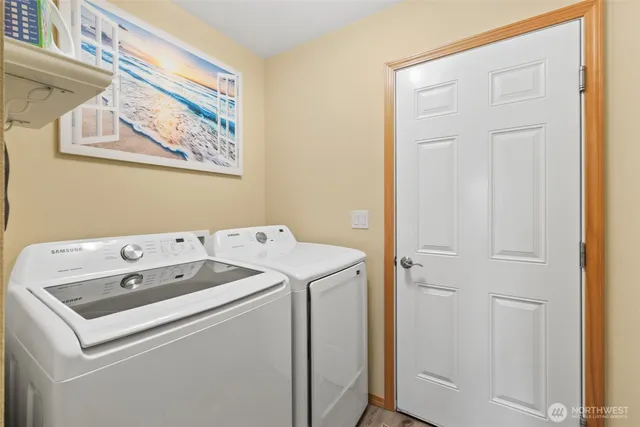 a bedroom with two beds and a window