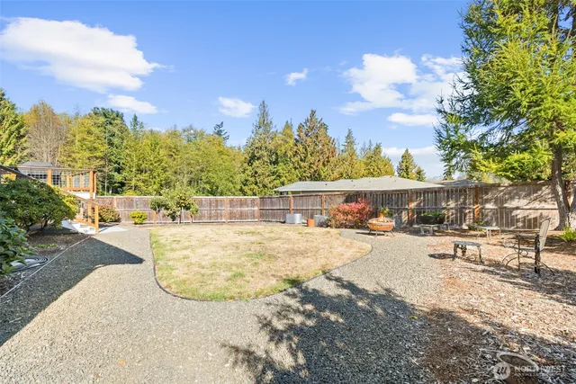 a view of backyard with a patio