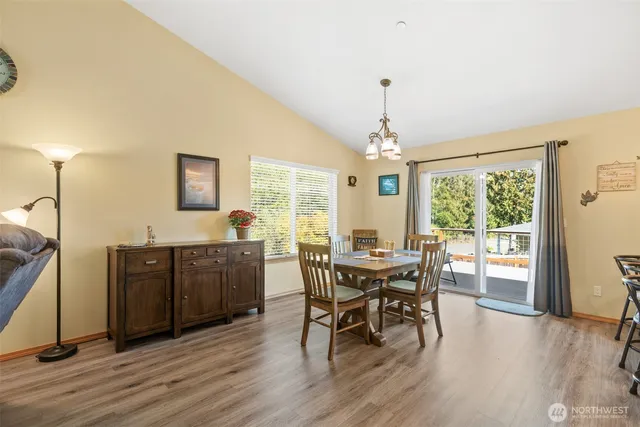 a view of a dining room with furniture window and outside view