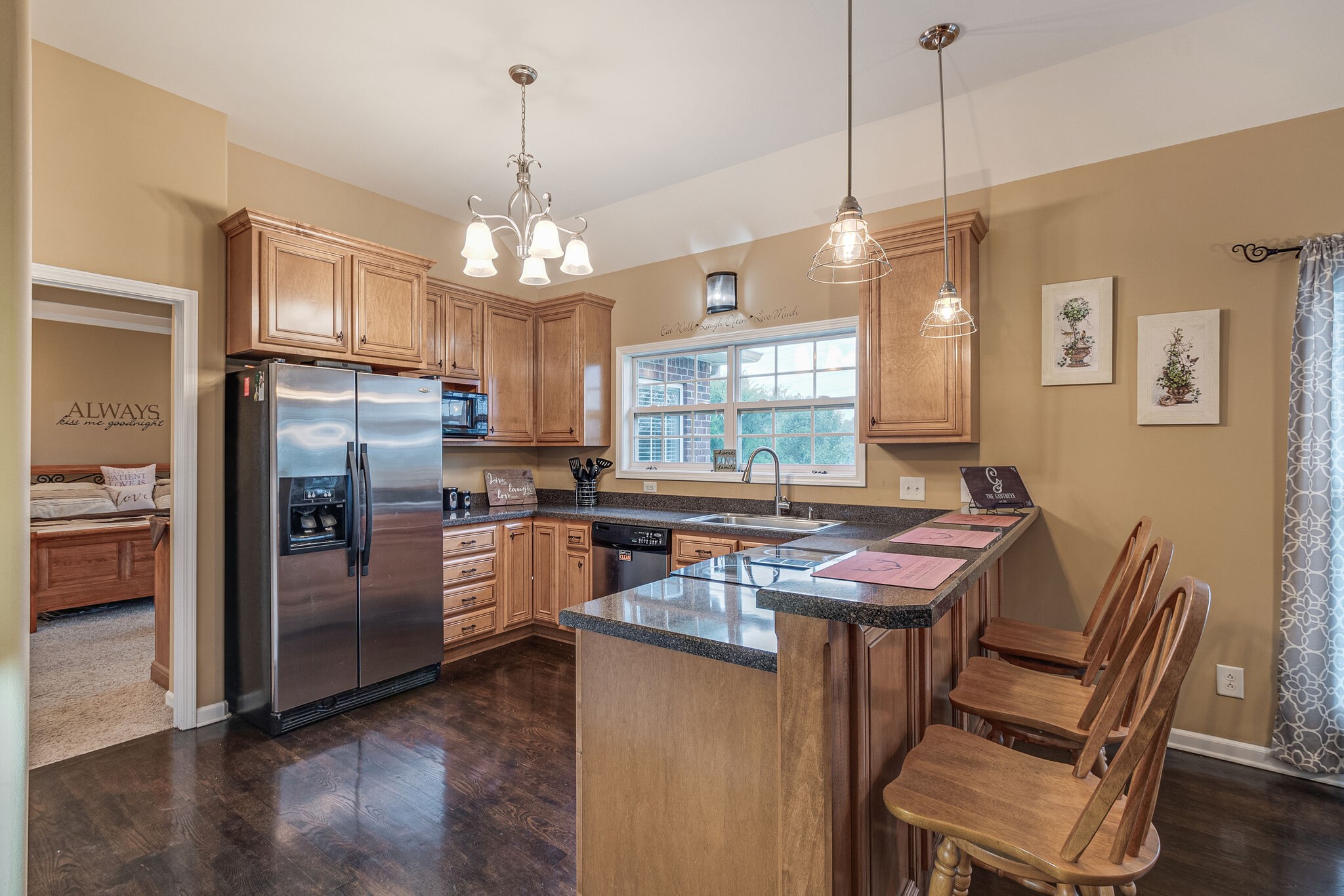 2113 Burford Road Lebanon, TN 37087 - Photo 11 of 35 a kitchen with refrigerator a stove and chairs