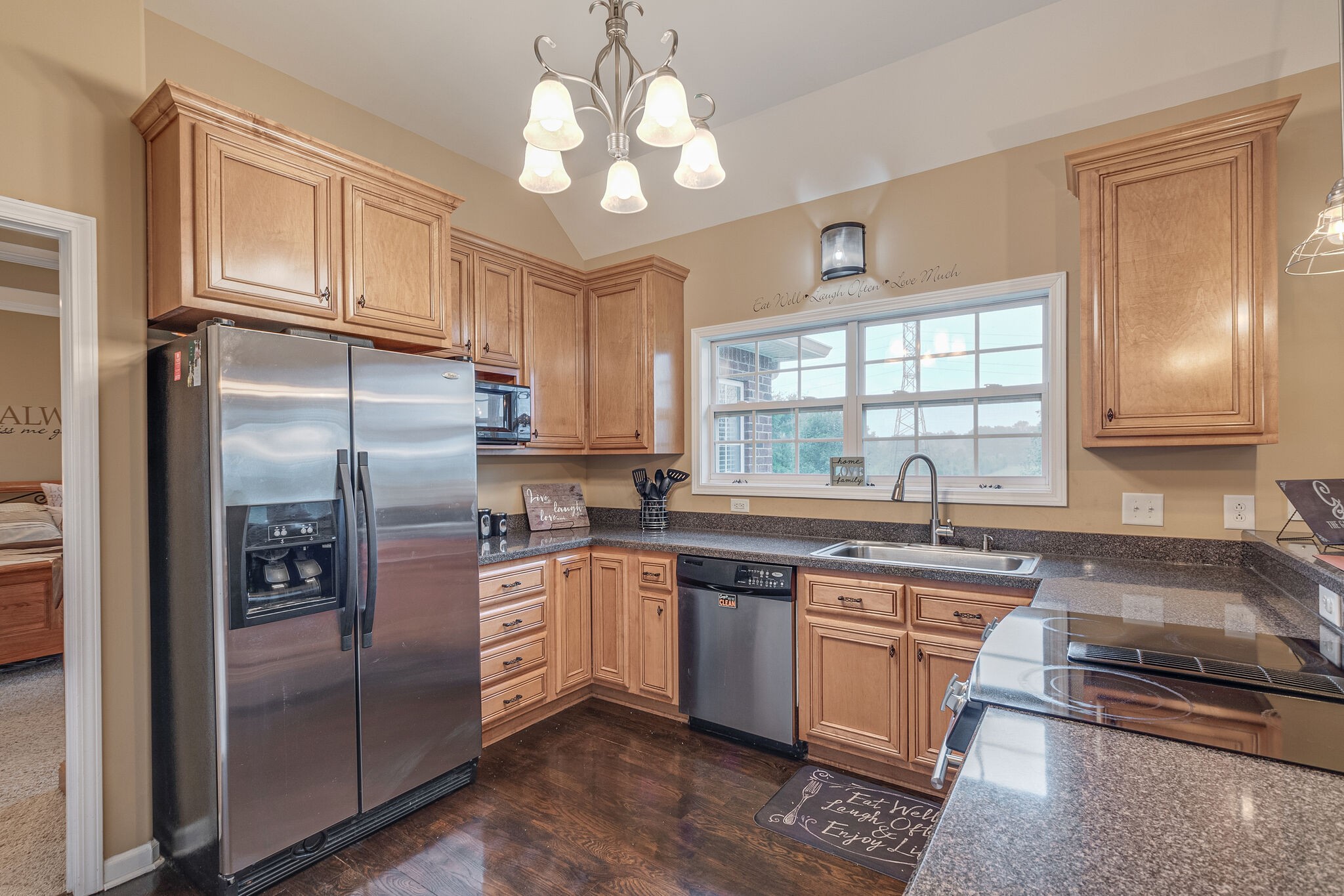 2113 Burford Road Lebanon, TN 37087 - Photo 12 of 35 a kitchen with stainless steel appliances granite countertop a refrigerator a sink dishwasher a stove and white cabinets with wooden floor
