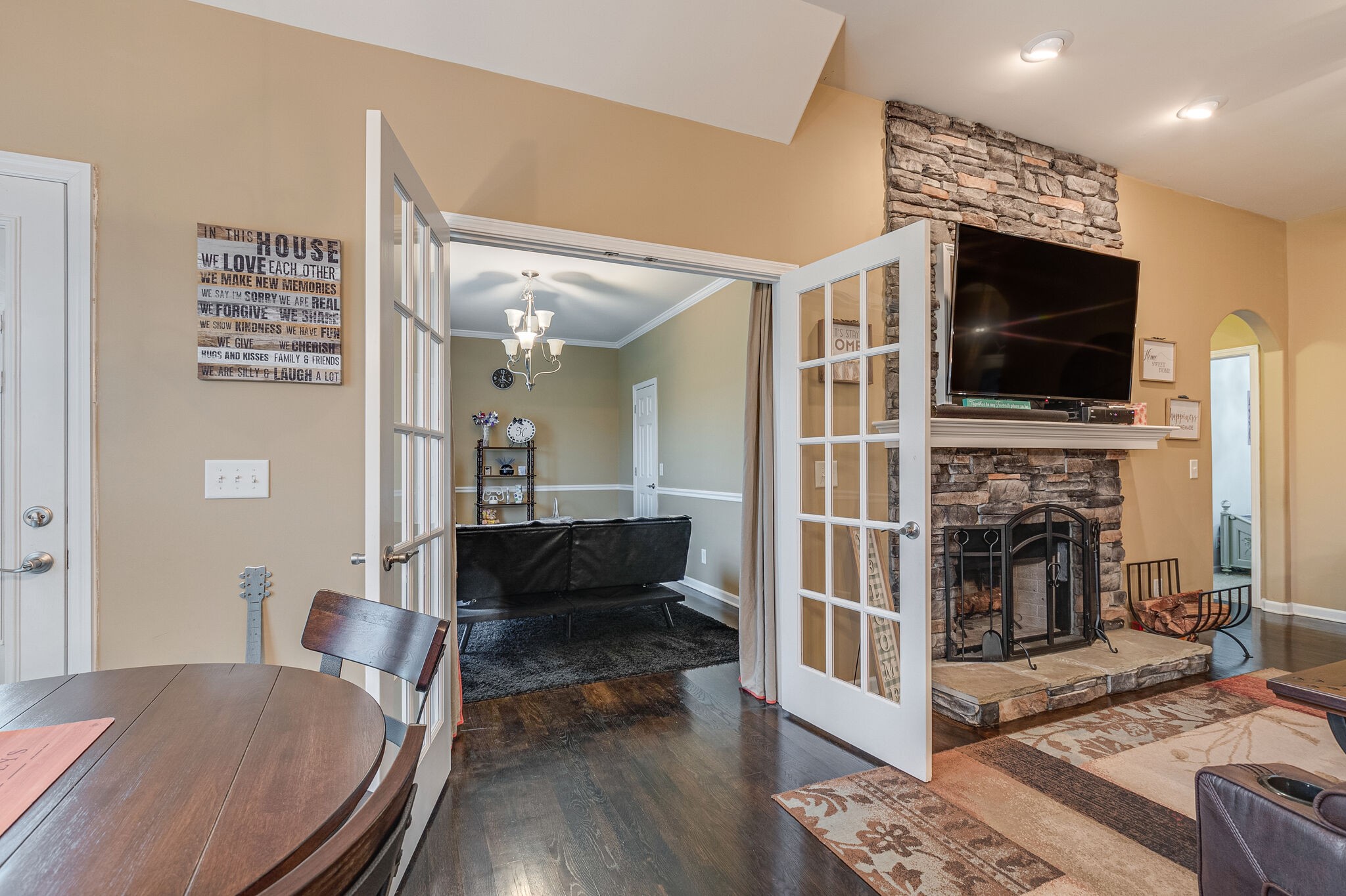 2113 Burford Road Lebanon, TN 37087 - Photo 15 of 35 a living room with furniture a flat screen tv and a fireplace