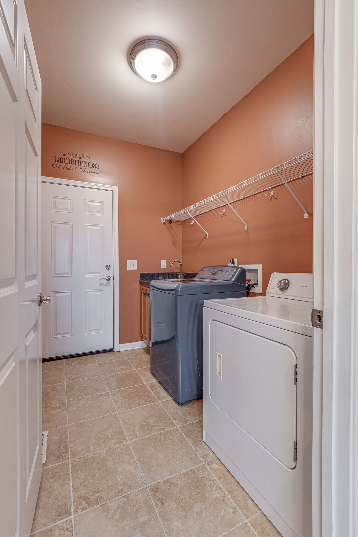 2113 Burford Road Lebanon, TN 37087 - Photo 18 of 35 a view of storage and utility room with washer and dryer
