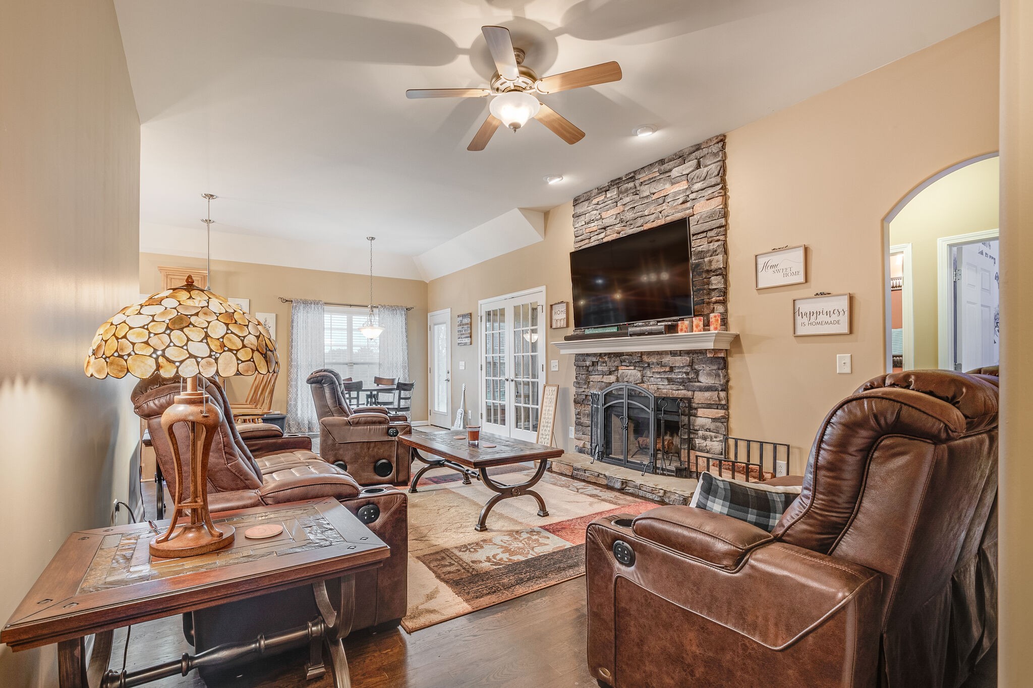 2113 Burford Road Lebanon, TN 37087 - Photo 5 of 35 a living room with furniture a fireplace and a flat screen tv