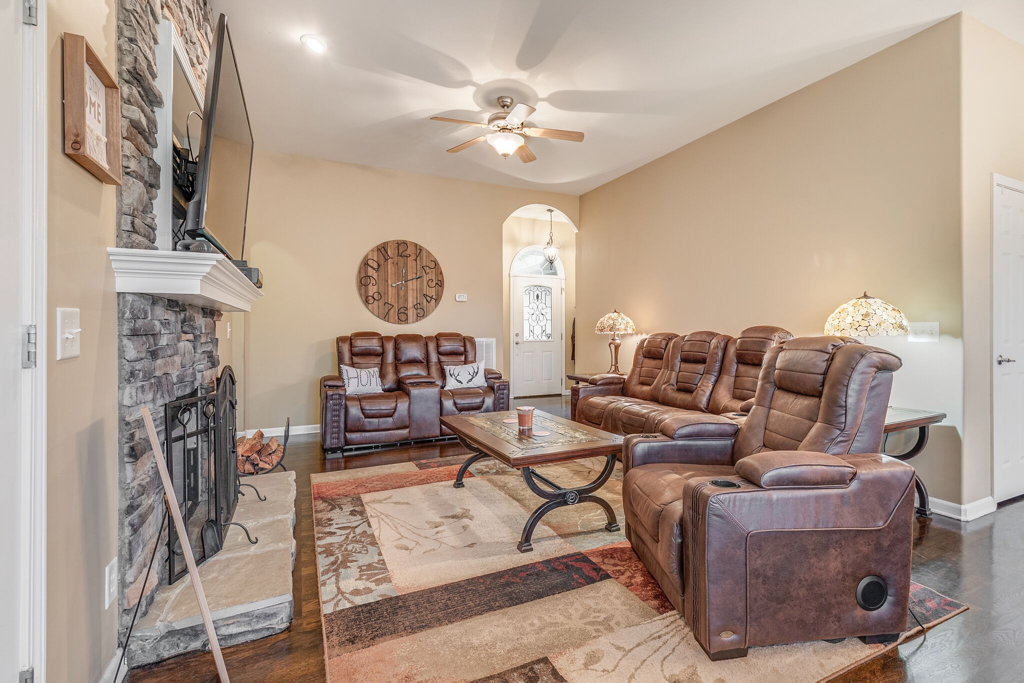 2113 Burford Road Lebanon, TN 37087 - Photo 7 of 35 a living room with furniture a fireplace and a chandelier