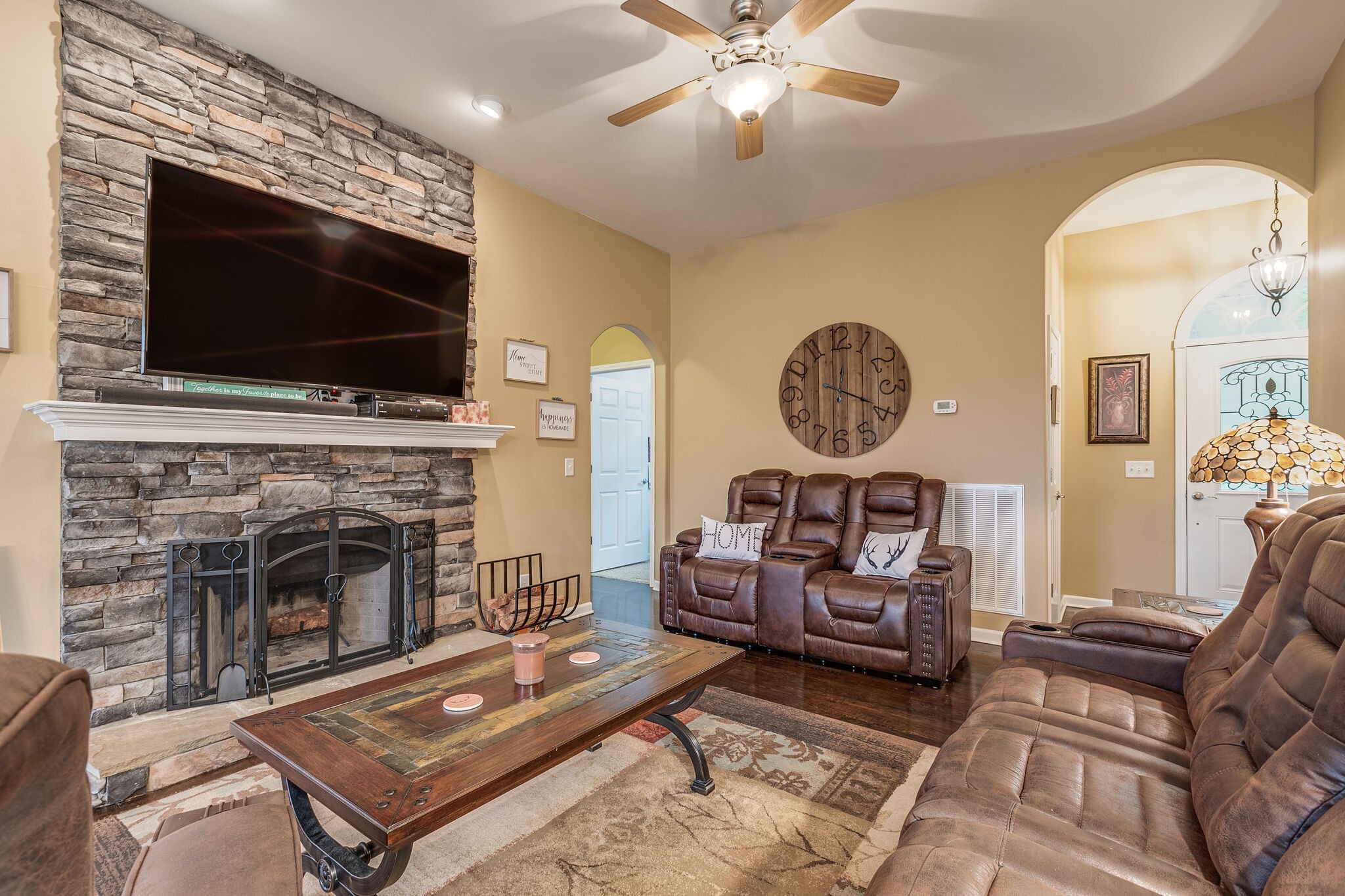 2113 Burford Road Lebanon, TN 37087 - Photo 8 of 35 a living room with furniture a flat screen tv and a fireplace