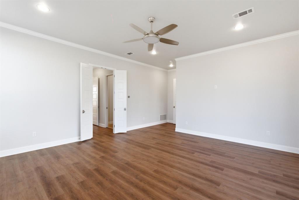 4600 A Old Brock Road Weatherford, TX 76087 - Photo 16 of 40 Empty room featuring crown molding, dark wood-type flooring, ceiling fan, and recessed lighting