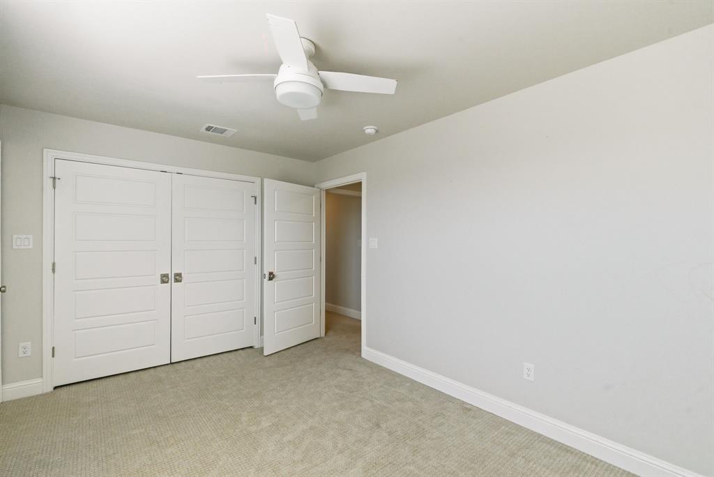 4600 A Old Brock Road Weatherford, TX 76087 - Photo 29 of 40 Unfurnished bedroom featuring light carpet, ceiling fan, and a closet