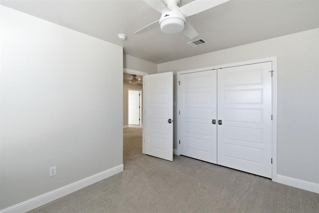 4600 A Old Brock Road Weatherford, TX 76087 - Photo 32 of 40 Unfurnished bedroom with light carpet, ceiling fan, and a closet
