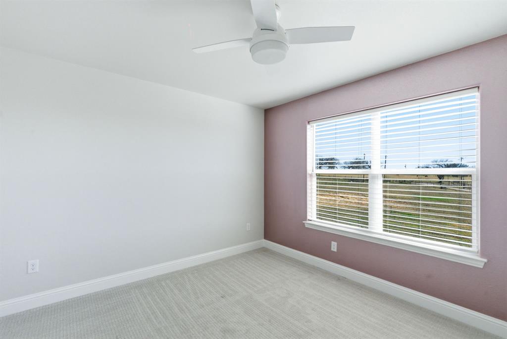 4600 A Old Brock Road Weatherford, TX 76087 - Photo 36 of 40 Empty room with light colored carpet and ceiling fan