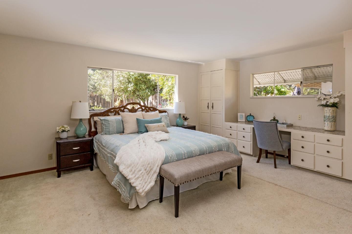 20184 Pierce Road Saratoga, CA 95070 - Photo 12 of 30 a bedroom with a bed and a dresser