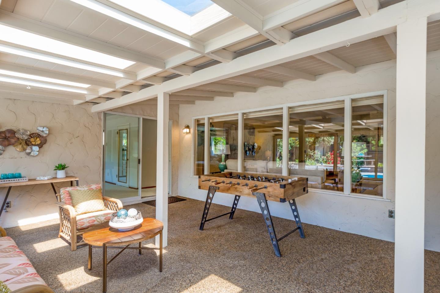 20184 Pierce Road Saratoga, CA 95070 - Photo 19 of 30 a living room with furniture and a large window
