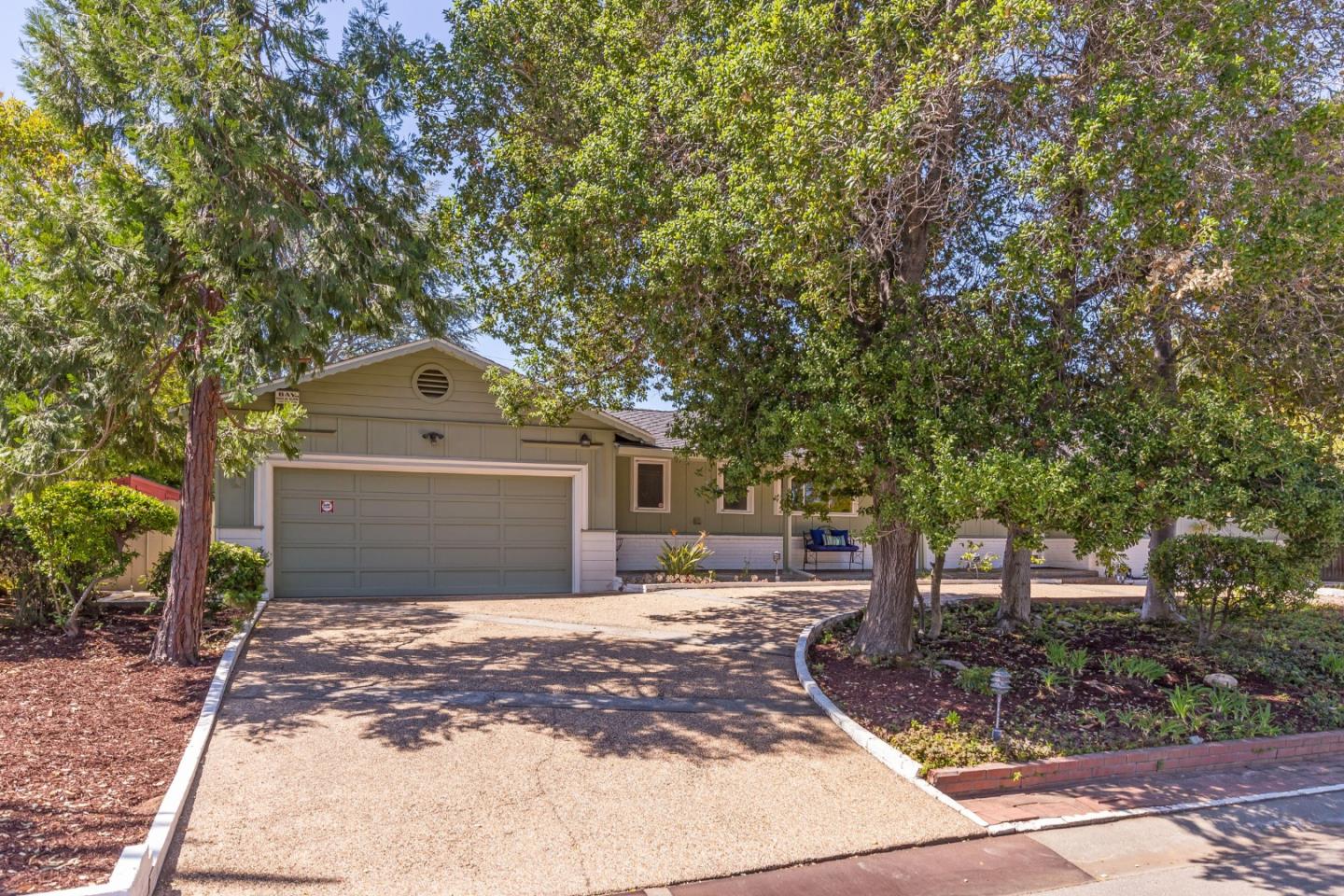 20184 Pierce Road Saratoga, CA 95070 - Photo 2 of 30 a front view of a house with a yard and a garage