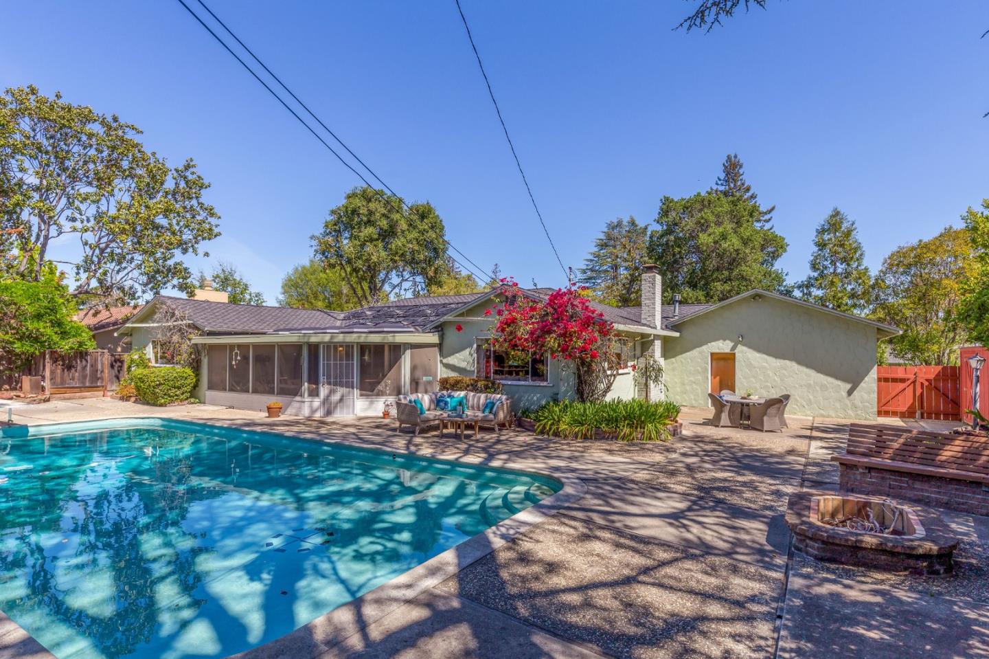 20184 Pierce Road Saratoga, CA 95070 - Photo 21 of 30 a front view of house with yard outdoor seating and barbeque oven