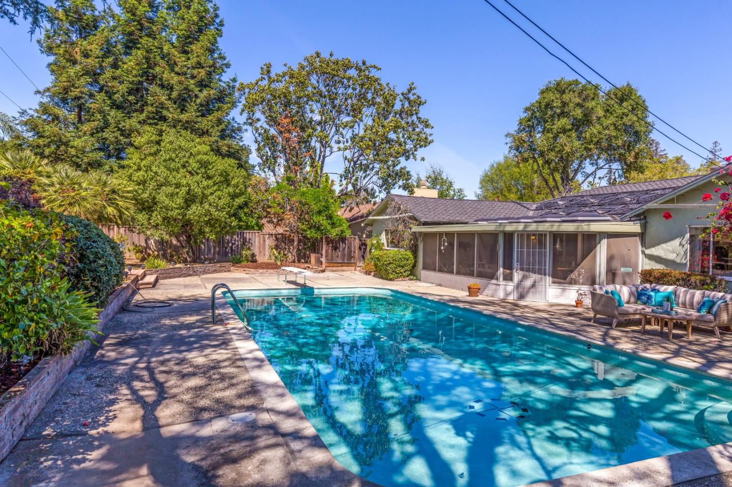 20184 Pierce Road Saratoga, CA 95070 - Photo 22 of 30 a front view of a house with a yard