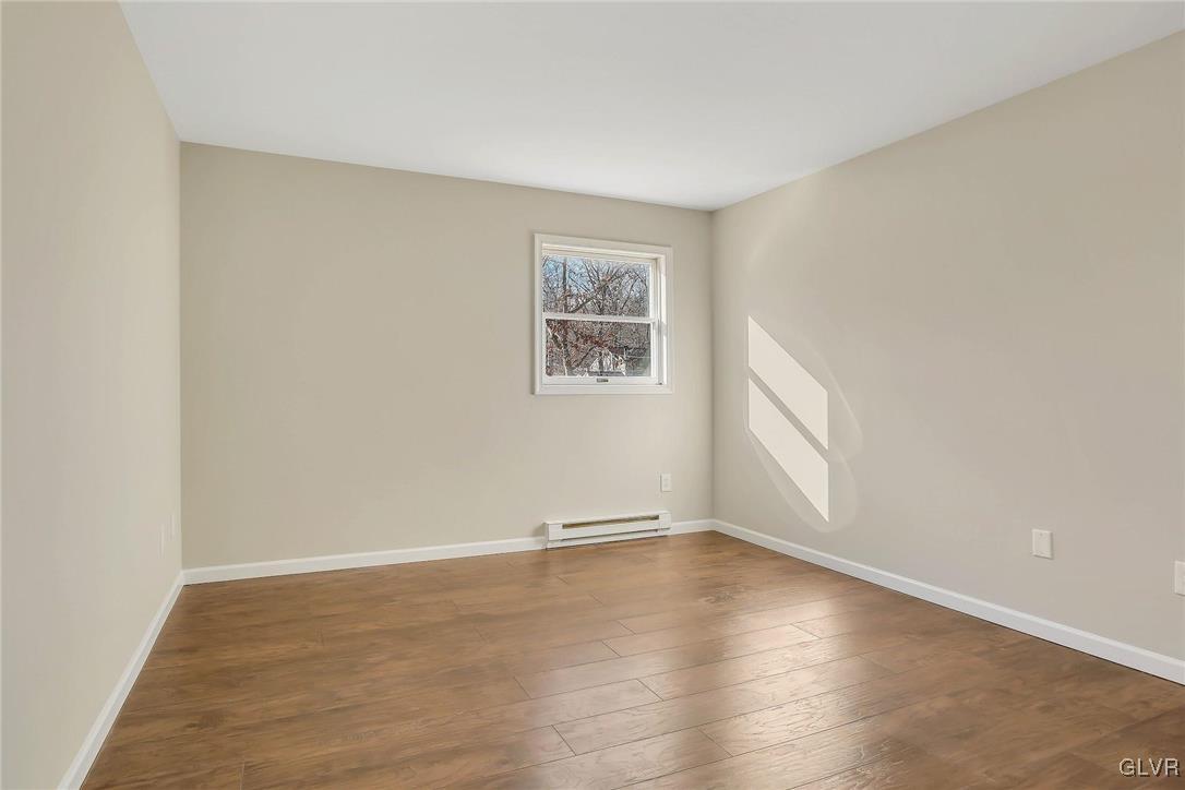 111 Brewster Way East Stroudsburg, PA 18301 - Photo 18 of 30 an empty room with wooden floor and windows