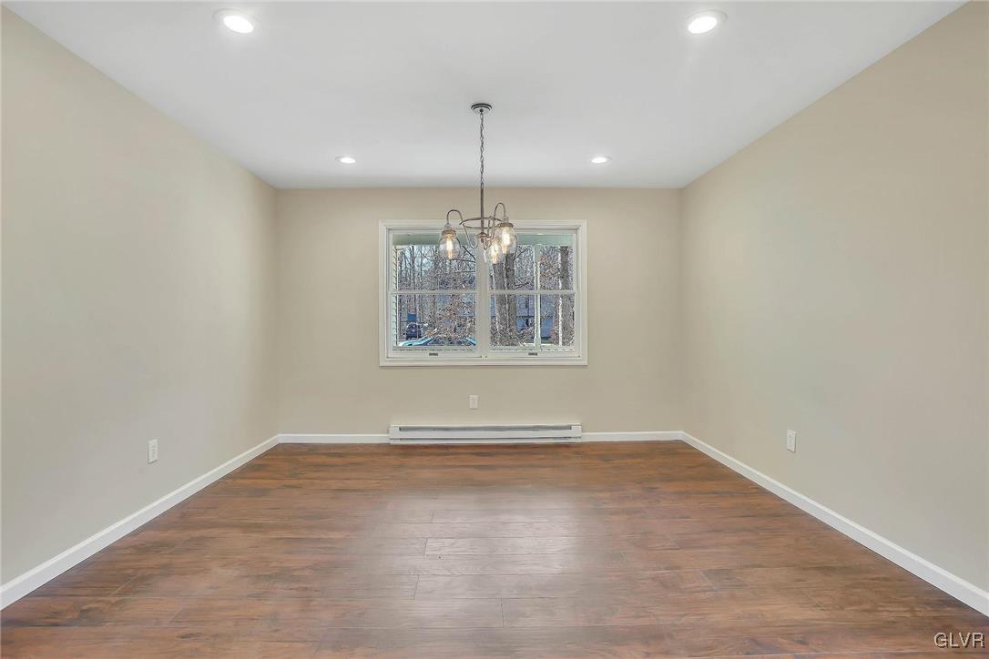 111 Brewster Way East Stroudsburg, PA 18301 - Photo 6 of 30 a view of wooden floor chandelier and window in a room