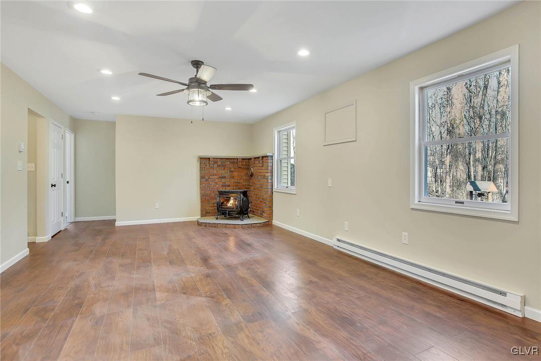 111 Brewster Way East Stroudsburg, PA 18301 - Photo 7 of 30 an empty room with windows and ceiling fan