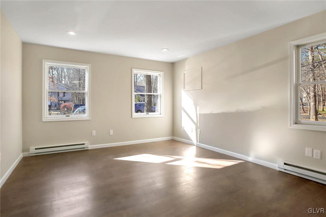 111 Brewster Way East Stroudsburg, PA 18301 - Photo 9 of 30 a view of a big room with wooden floor and windows