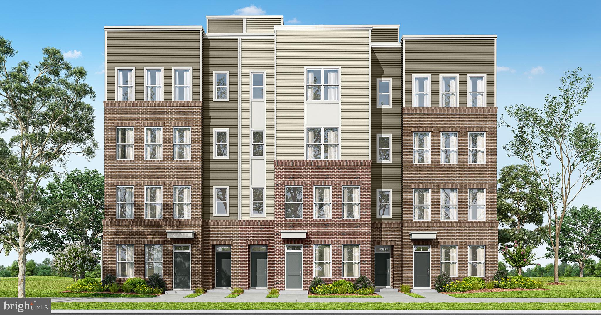 10401 White Granite Drive, Unit 2 Oakton, VA 22124 - Photo 1 of 8 a front view of a residential apartment building with a yard
