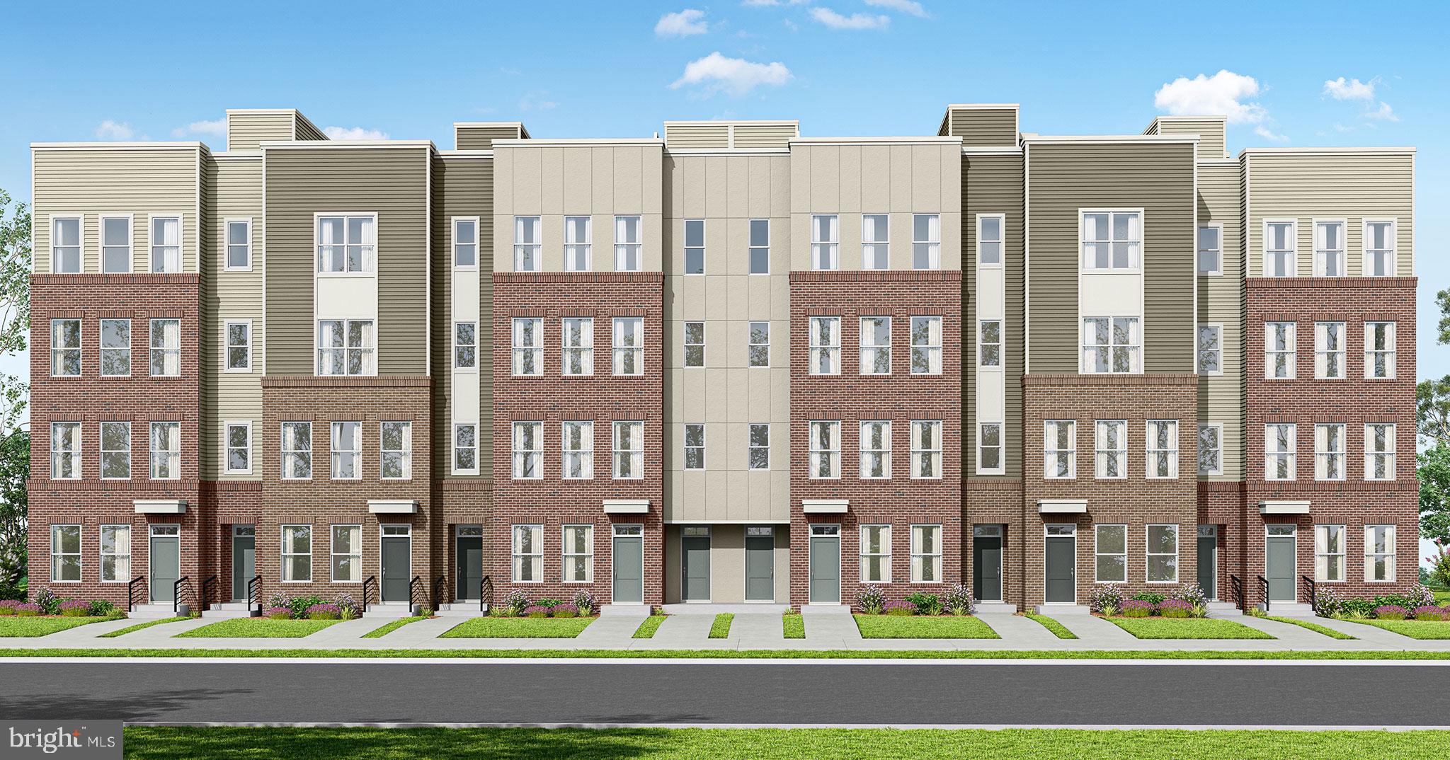 10401 White Granite Drive, Unit 2 Oakton, VA 22124 - Photo 3 of 8 a front view of a residential apartment building with a yard