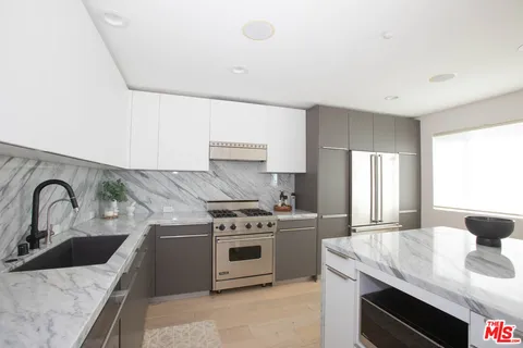 a kitchen with a stove and a sink