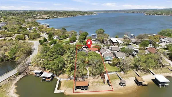 an aerial view of a house with a lake view