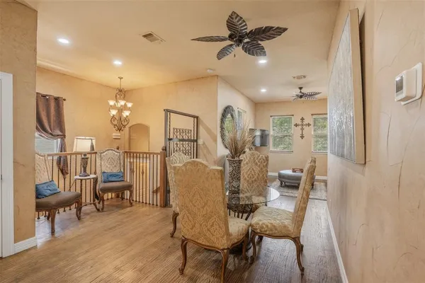 a kitchen with stainless steel appliances granite countertop a sink and a refrigerator