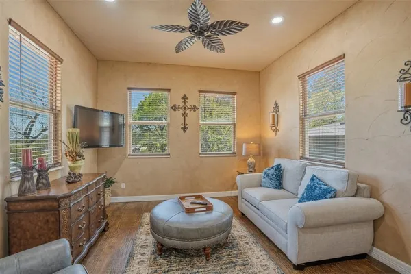 a living room with furniture and a chandelier