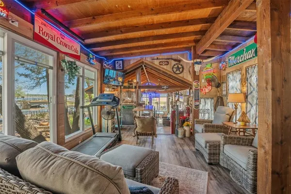 a living room with furniture a ceiling fan and a rug