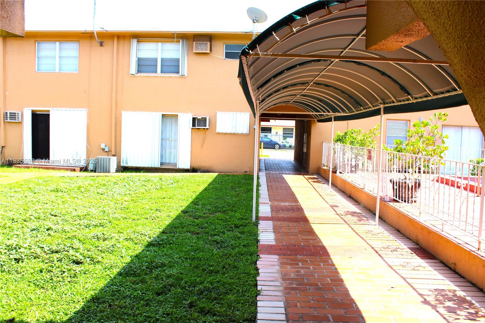 1154 West 35th Street, Unit 221 Hialeah, FL 33012 - Photo 33 of 39 a view of swimming pool with a backyard