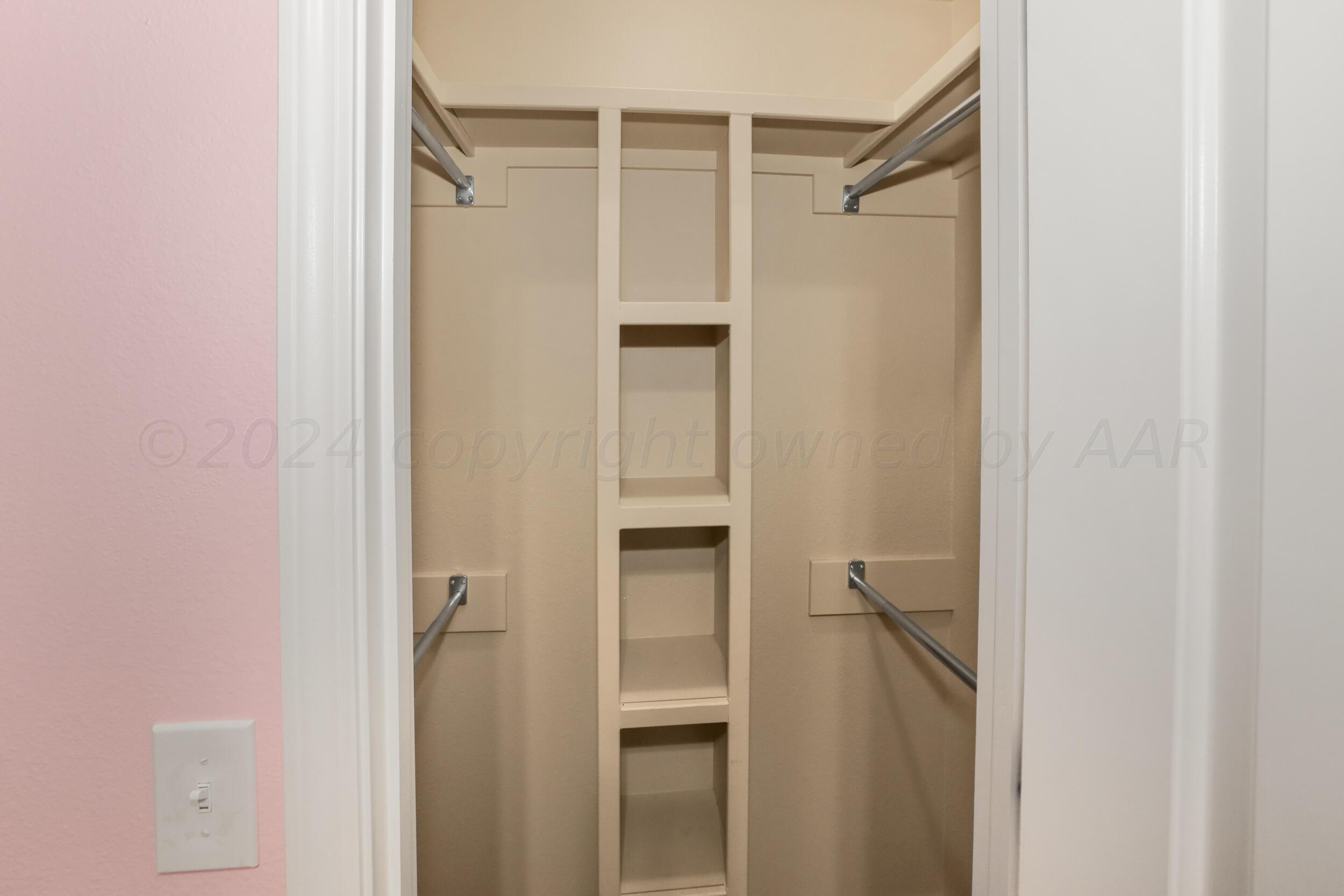 7303 Rochester Drive Amarillo, TX 79118 - Photo 21 of 38 a bathroom with a shower and a glass door