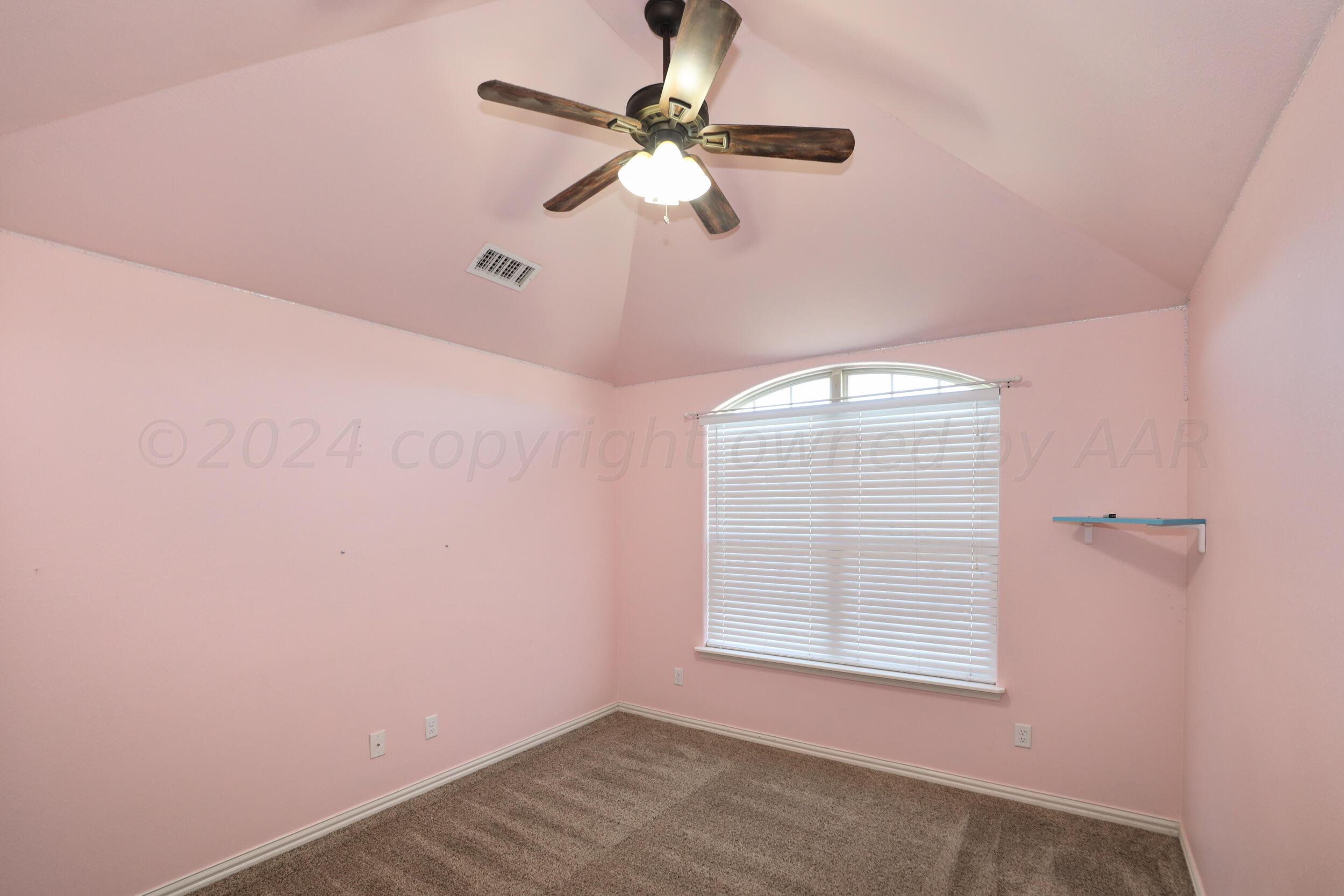 7303 Rochester Drive Amarillo, TX 79118 - Photo 22 of 38 an empty room with a window