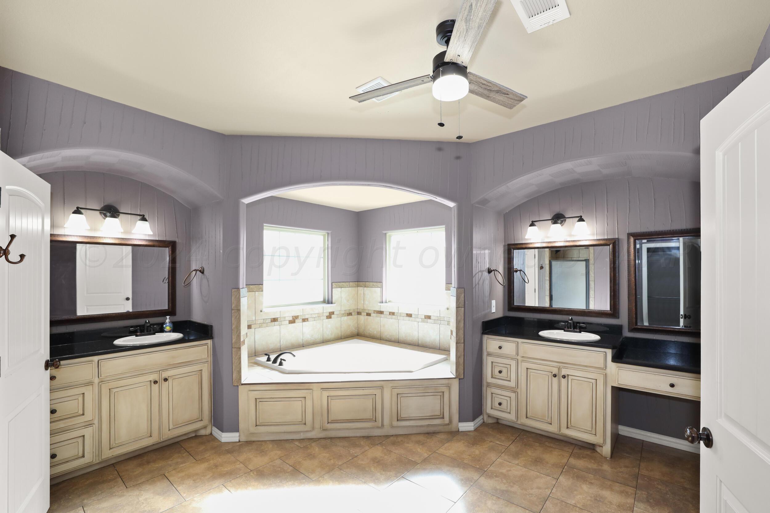 7303 Rochester Drive Amarillo, TX 79118 - Photo 27 of 38 a spacious bathroom with a double vanity sink mirror and bathtub