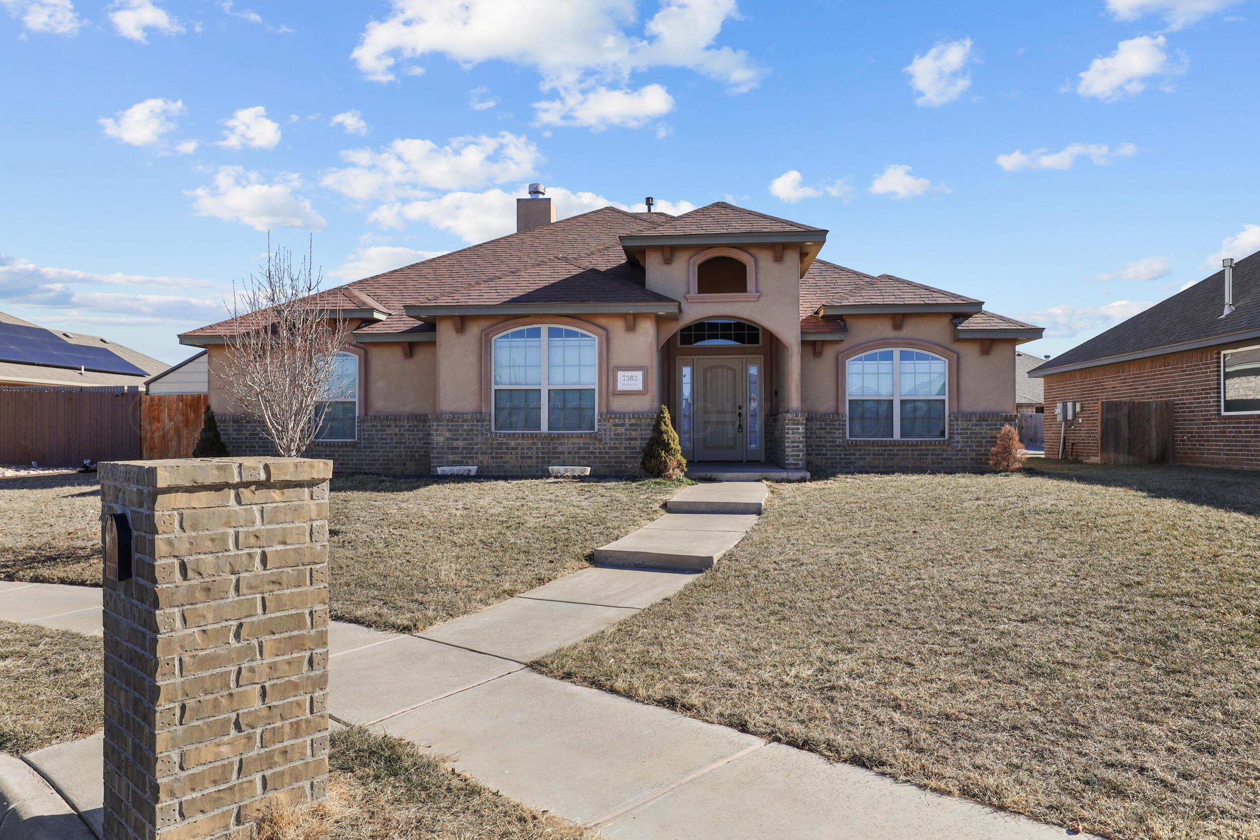 7303 Rochester Drive Amarillo, TX 79118 - Photo 3 of 38 a front view of a house with a yard