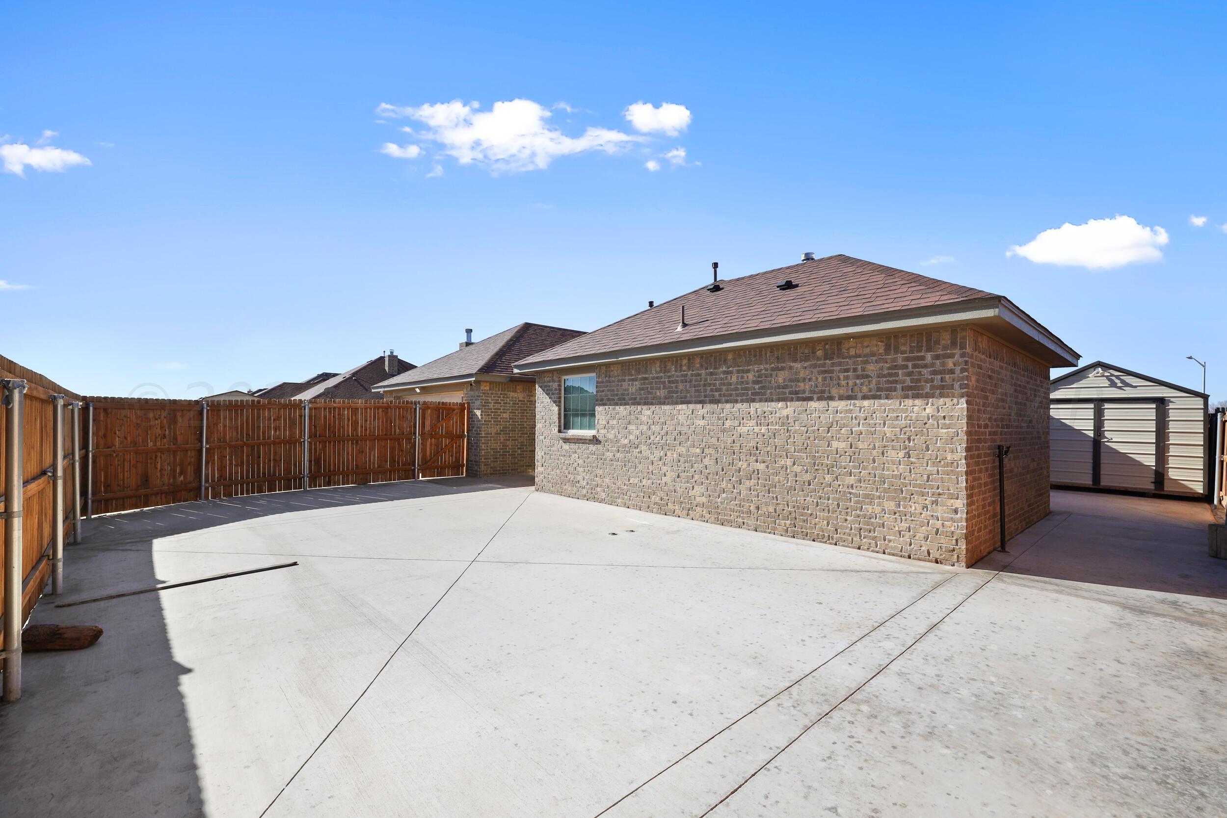 7303 Rochester Drive Amarillo, TX 79118 - Photo 35 of 38 a front view of a house with a yard