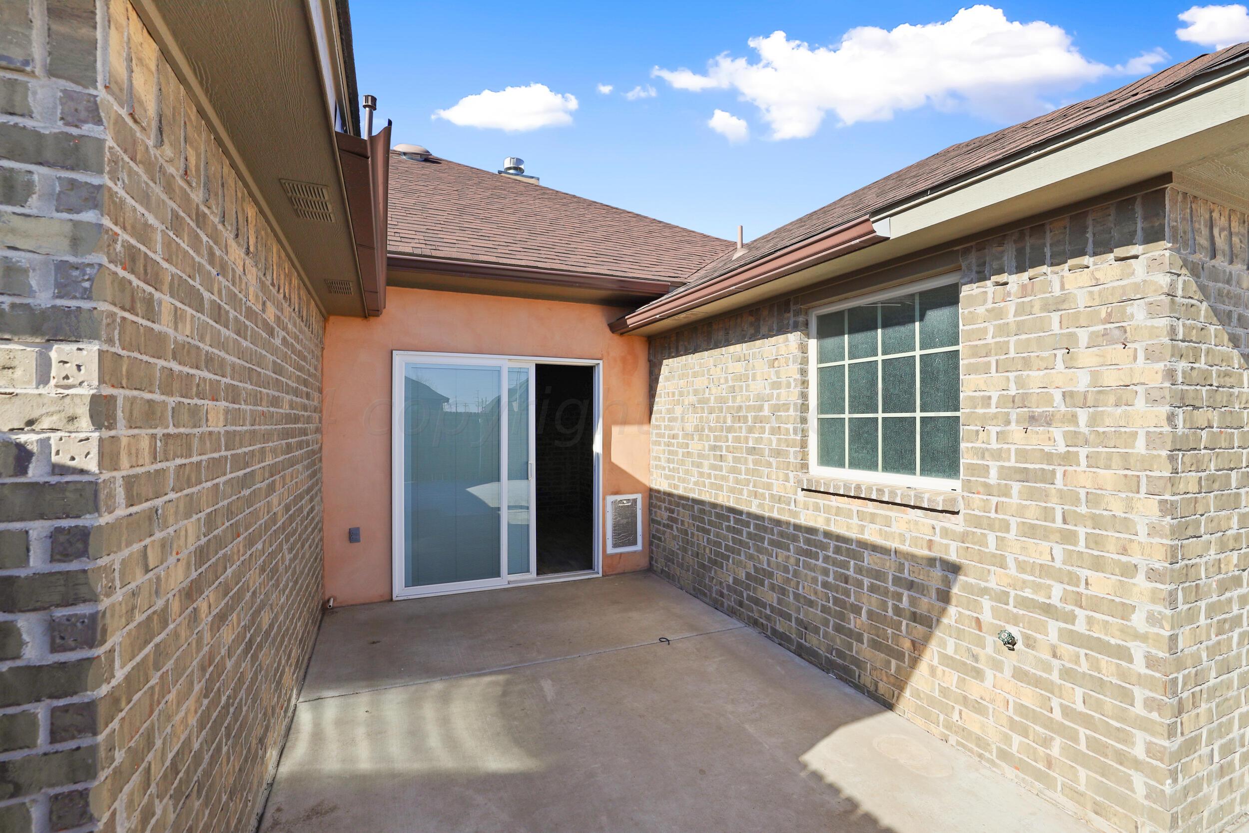 7303 Rochester Drive Amarillo, TX 79118 - Photo 37 of 38 a view of front door of house with window