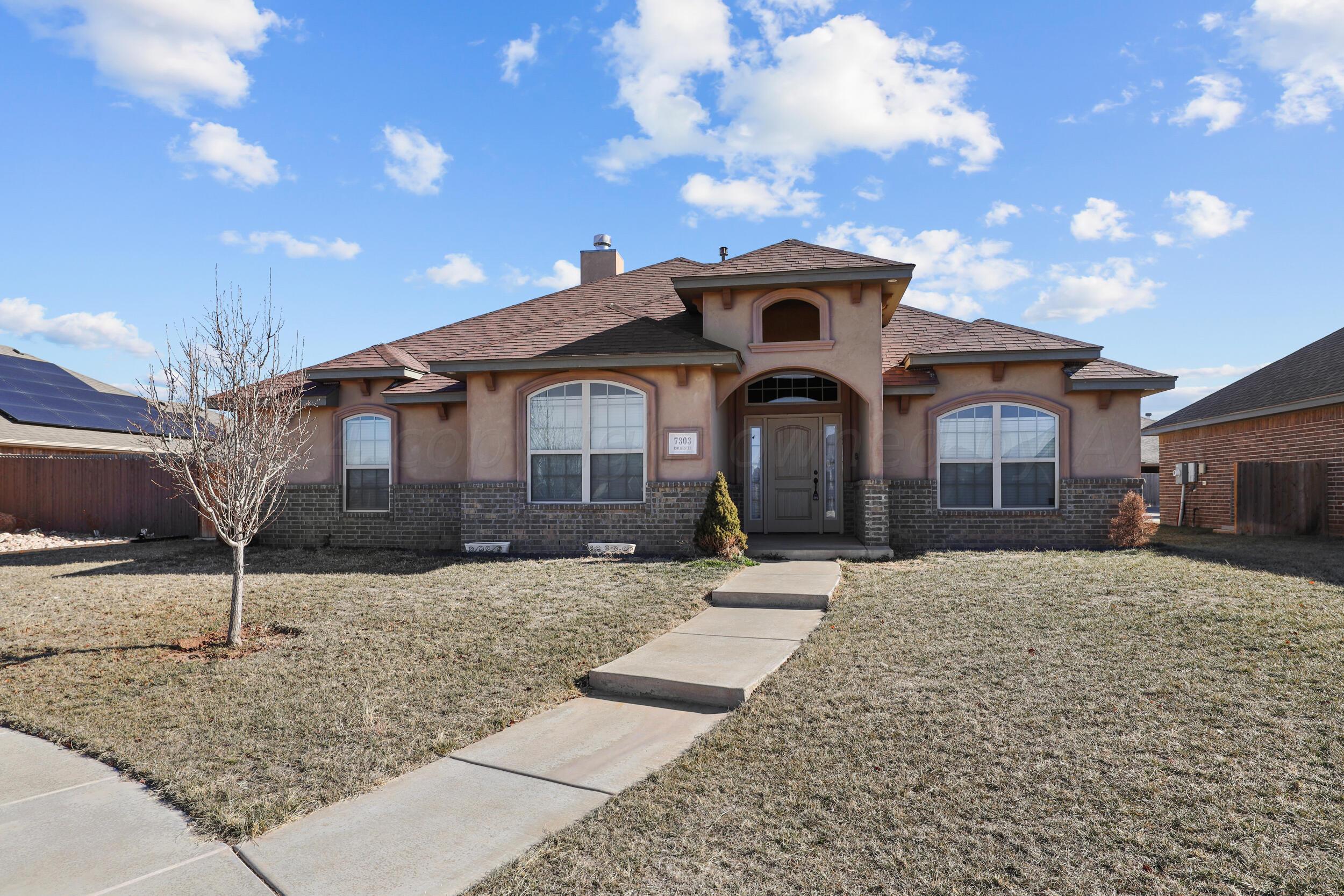 7303 Rochester Drive Amarillo, TX 79118 - Photo 4 of 38 a front view of a house with a yard