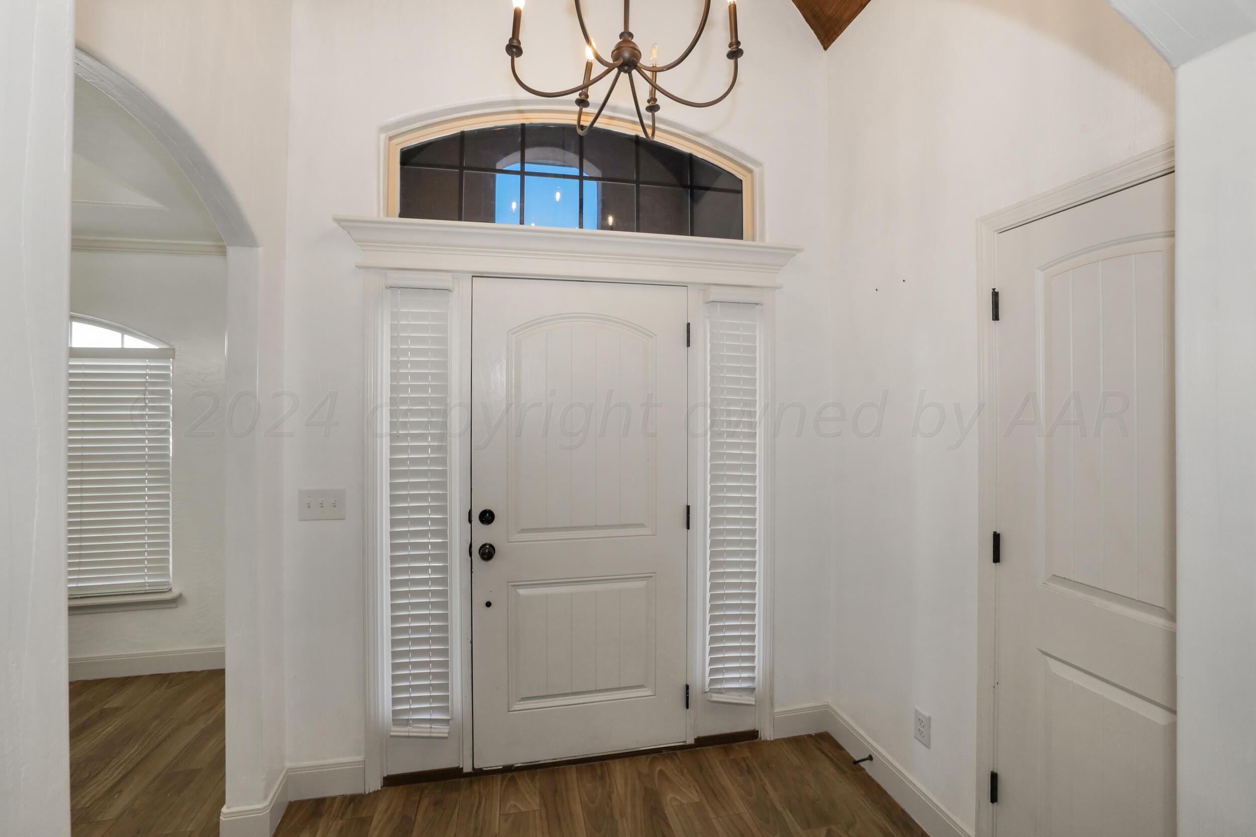 7303 Rochester Drive Amarillo, TX 79118 - Photo 7 of 38 a view of a hallway with wooden floor