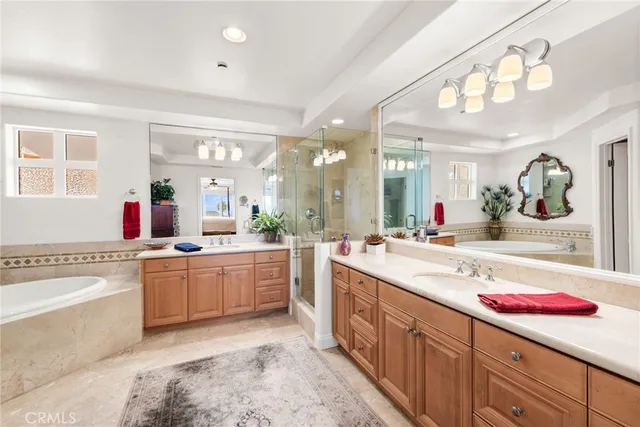 a large kitchen with a lot of counter space and wooden floor