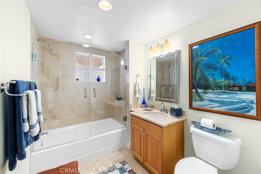 412 Arenoso Lane San Clemente, CA 92672 - Photo 21 of 23 a bathroom with a tub sink and mirror