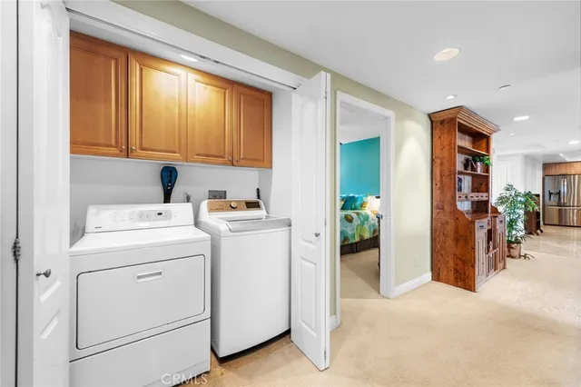 a view of hallway with washer and dryer