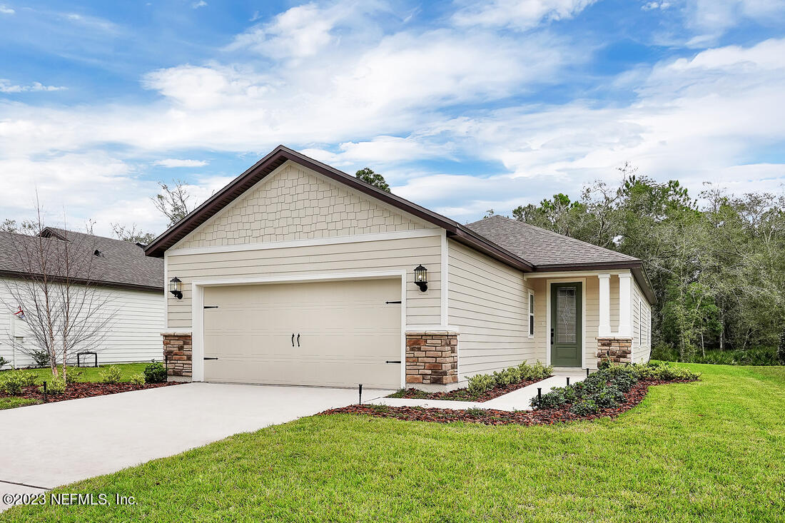 610 Morgans Treasure Road St. Augustine, FL 32084 - Photo 1 of 8 a front view of house with yard and green space