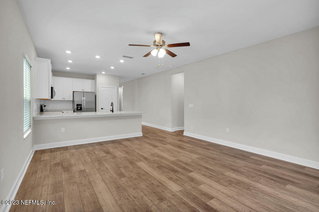 610 Morgans Treasure Road St. Augustine, FL 32084 - Photo 4 of 8 a view of kitchen with wooden floor and window