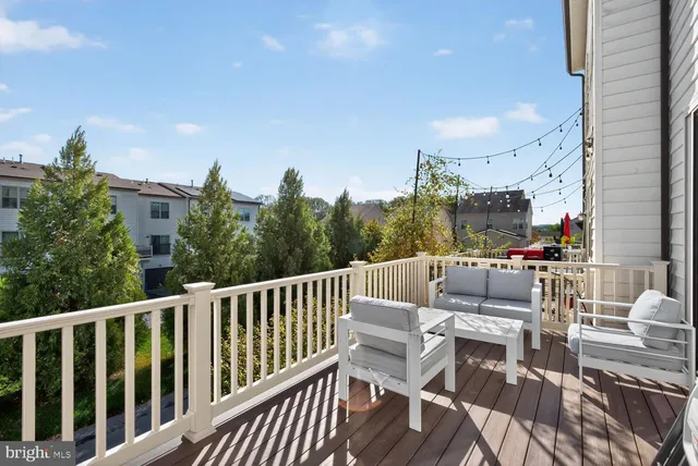 a view of a chairs and tables in the balcony