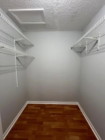 a view of a room with racks on the wall